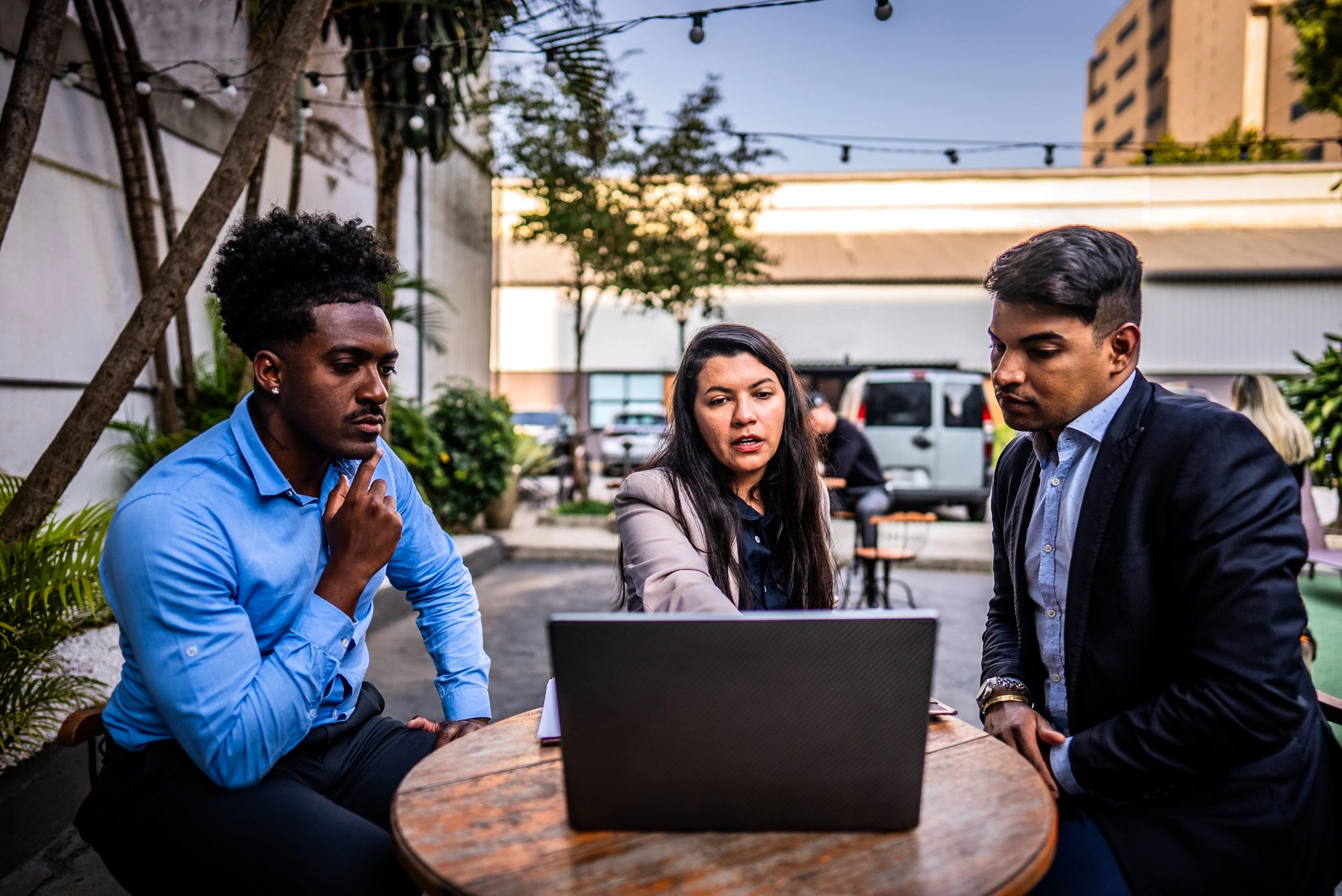 Small business team reviewing information on a laptop