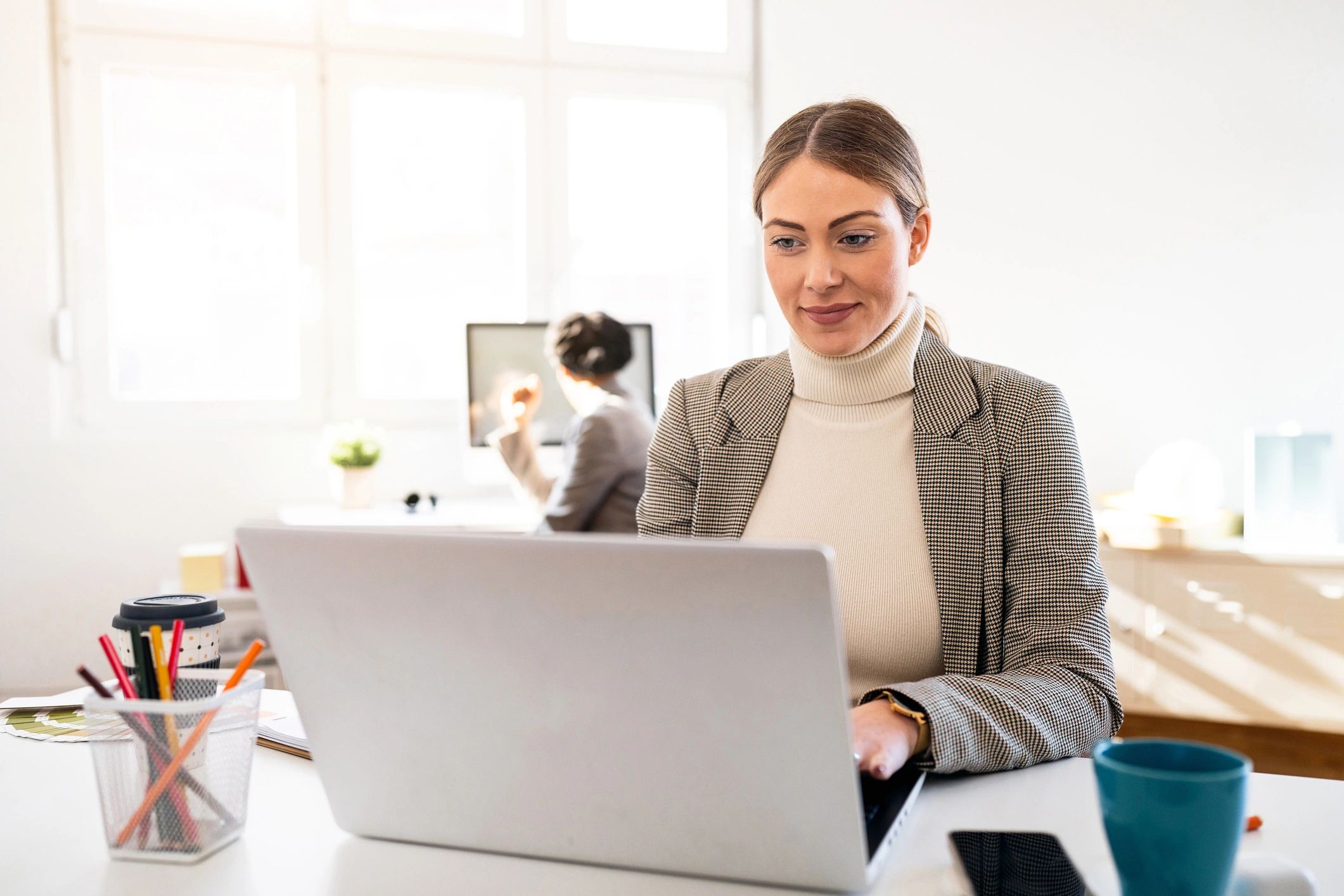 Office professional using a laptop in a secure work environment